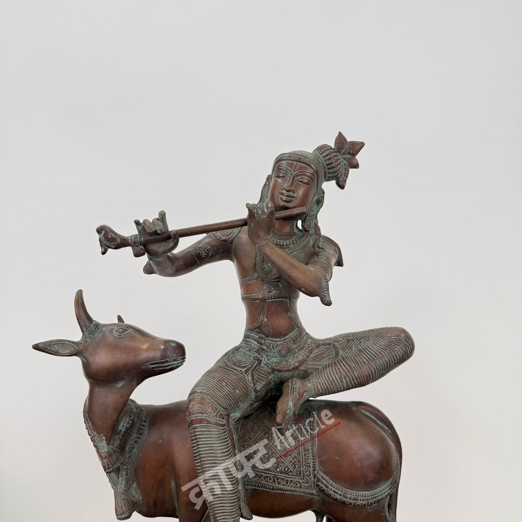 Brass Lord Krishna Seated on Cow