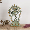 Decorative statue on a table with a plain background