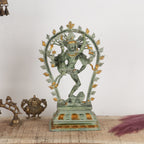 Decorative statue on a table with a plain background