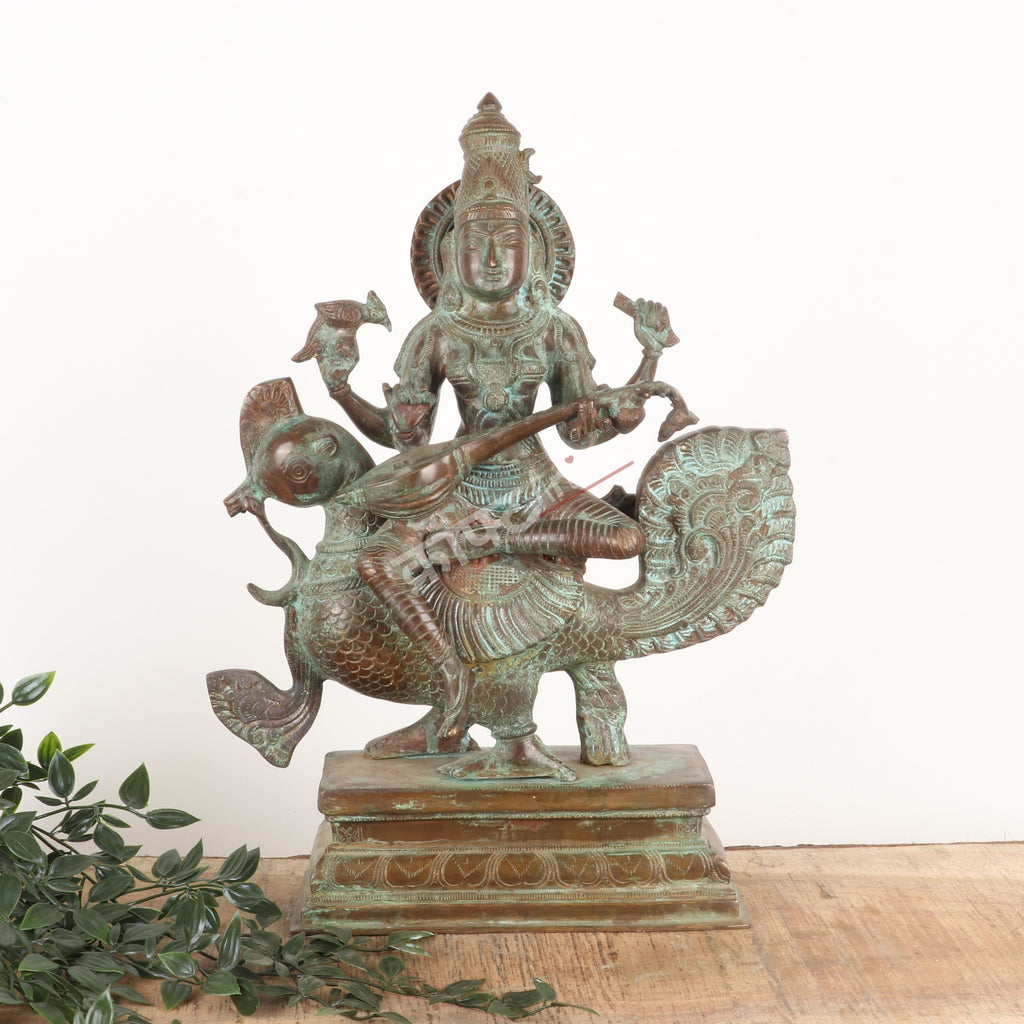 Brass Goddess Sarasvati Sculpture – Seated on Peacock